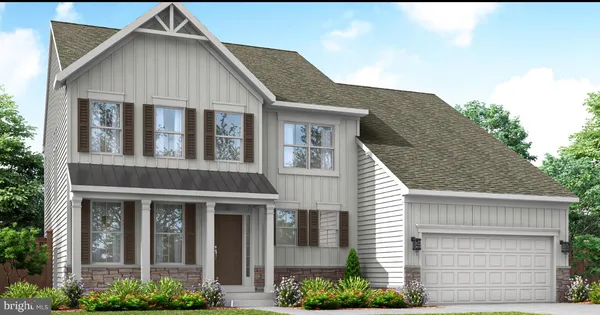 a view of a brick house with large windows