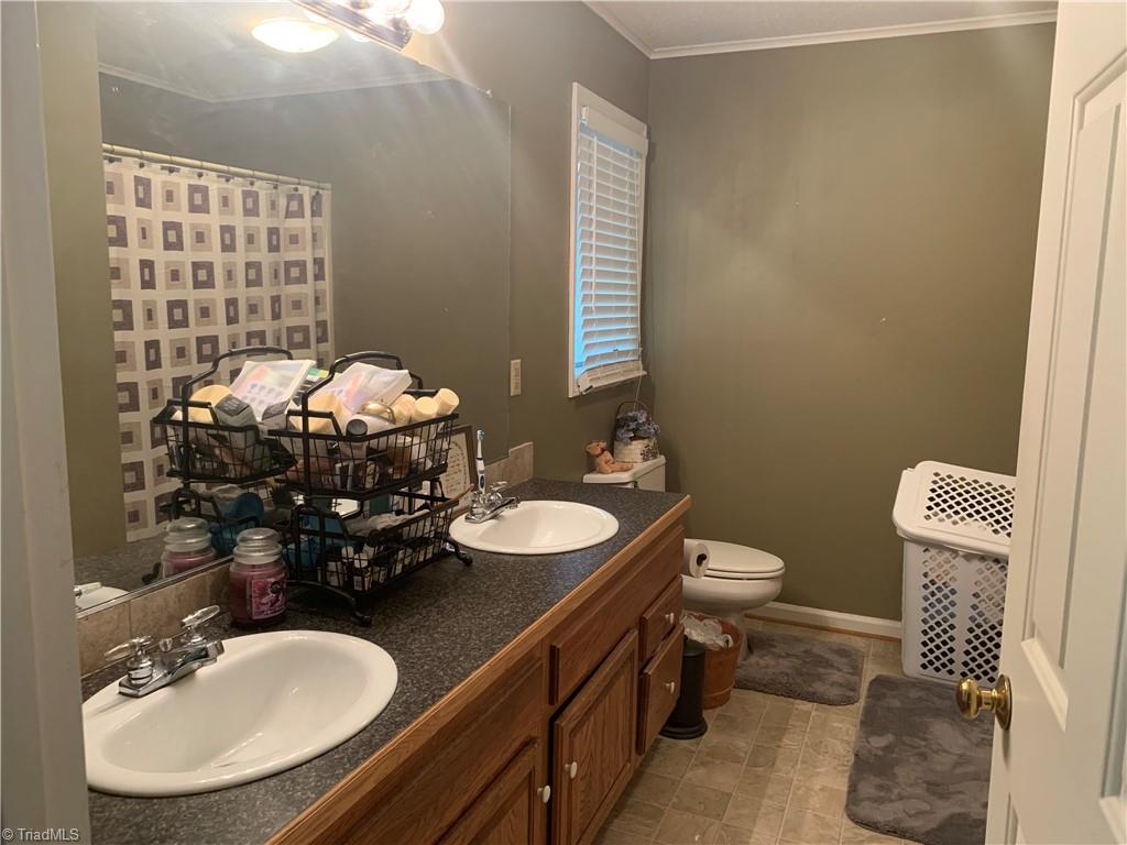 740 Burguss Road High Point, NC 27265 - Photo 18 of 34 master bath with double sinks & tub/shower