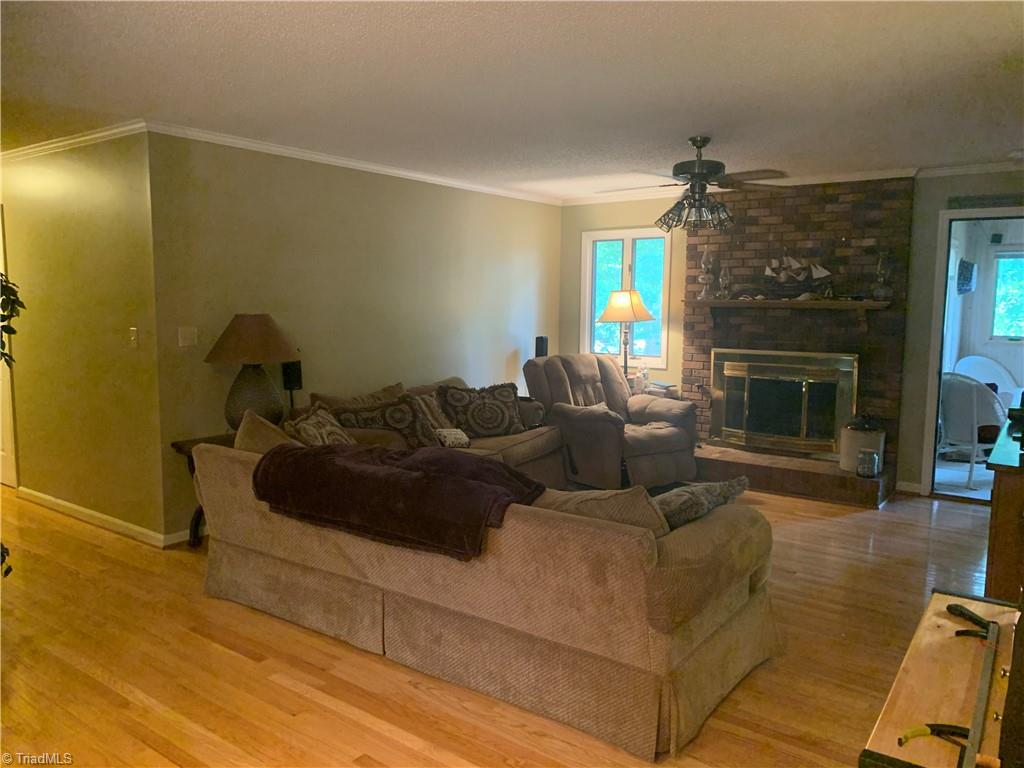 740 Burguss Road High Point, NC 27265 - Photo 3 of 34 living room with wood burning FP