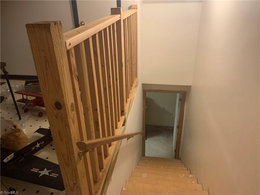 740 Burguss Road High Point, NC 27265 - Photo 26 of 34 stairs to garage from bonus room