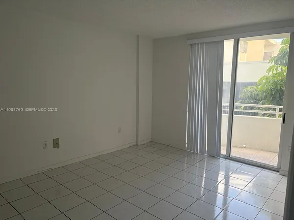 a view of an empty room and window