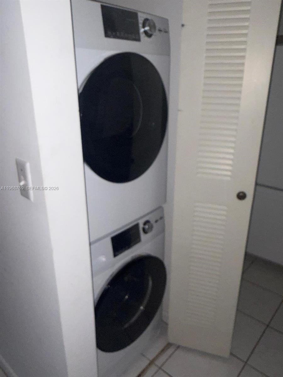 9156 Collins Avenue, Unit 204 Surfside, FL 33154 - Photo 17 of 17 a close up view of a washer and dryer