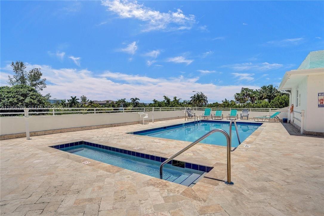 9156 Collins Avenue, Unit 204 Surfside, FL 33154 - Photo 2 of 17 a view of a lake with a terrace