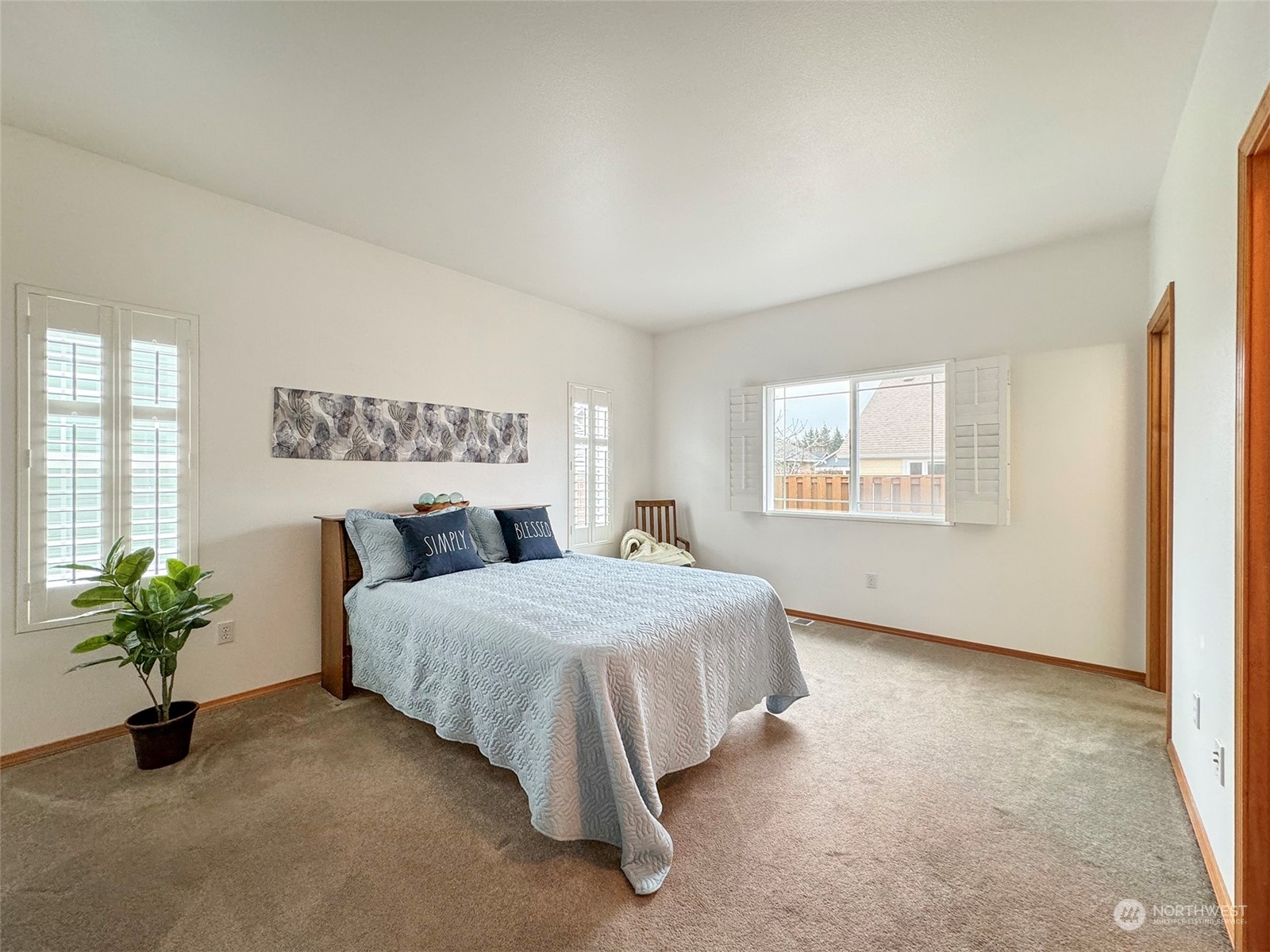 50 Nesting Place Sequim, WA 98382 - Photo 26 of 40 a bedroom with a bed potted plant on the dresser and a window