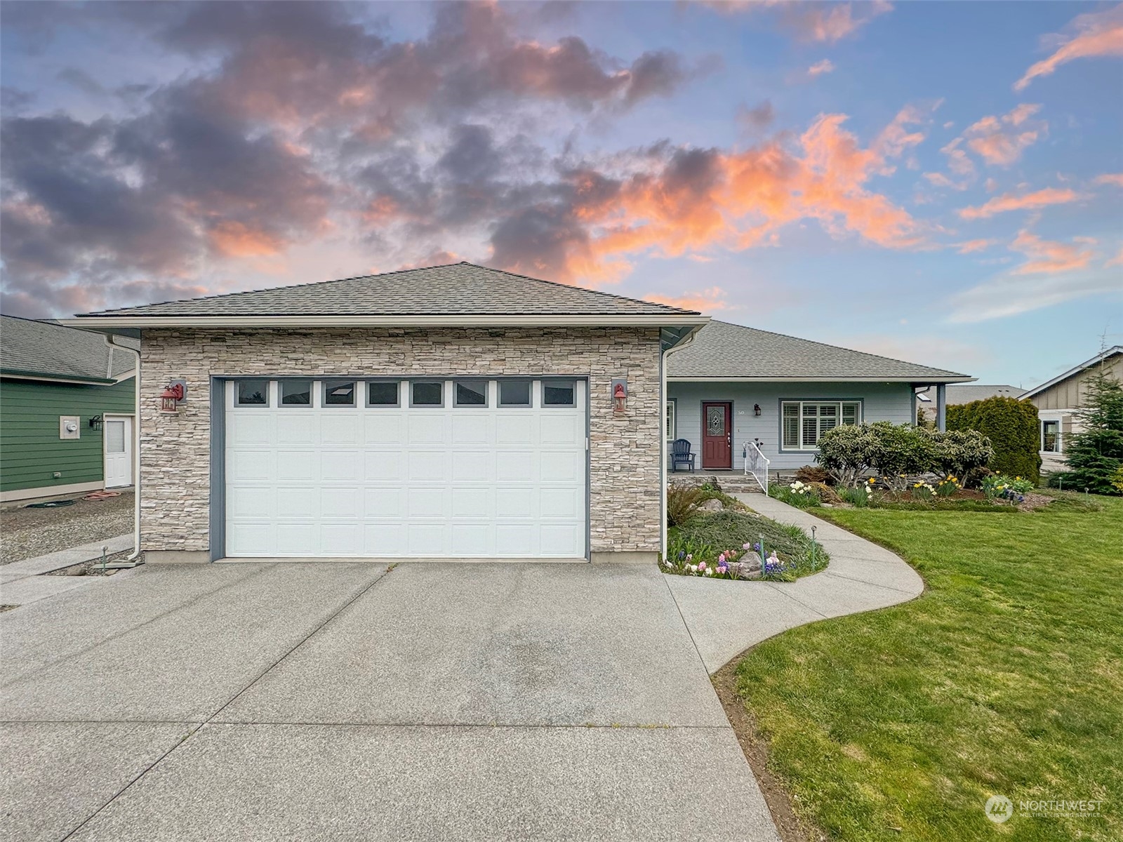 50 Nesting Place Sequim, WA 98382 - Photo 35 of 40 a front view of a house with a garden and yard