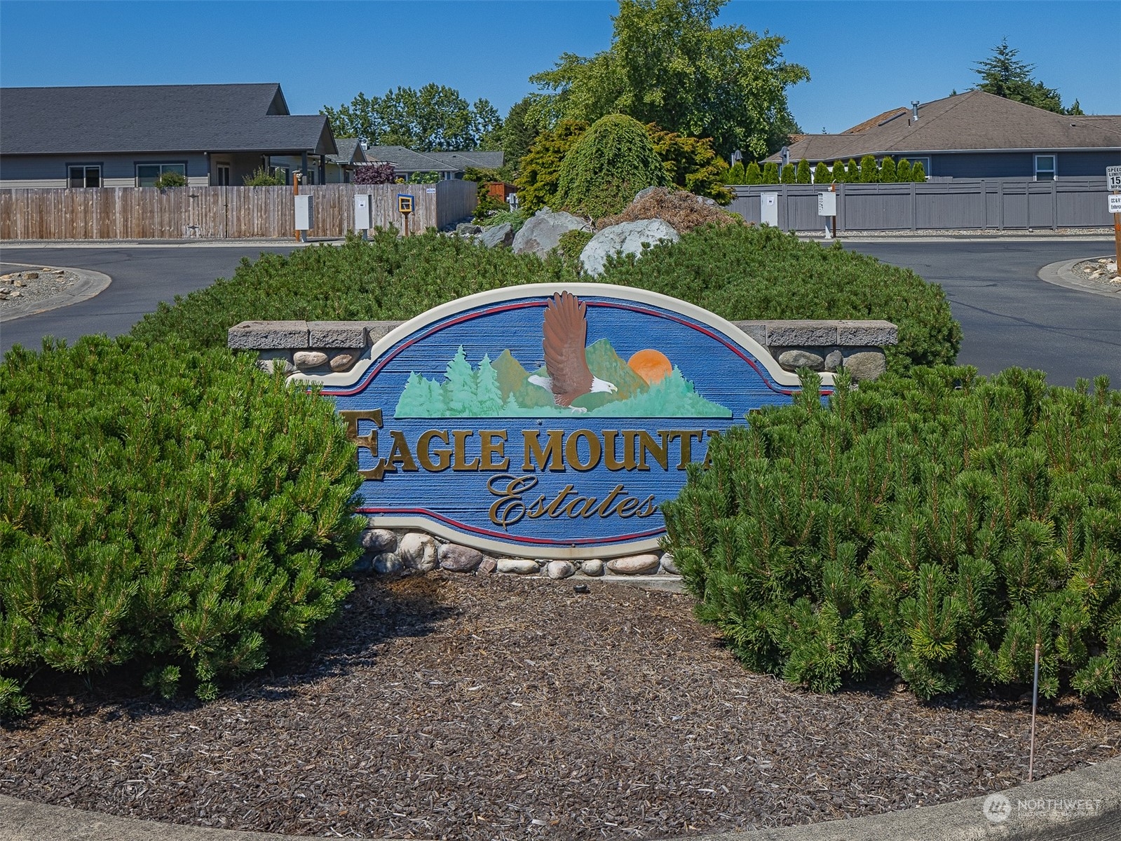 50 Nesting Place Sequim, WA 98382 - Photo 40 of 40 a view of a brick house with a small yard plants and large trees
