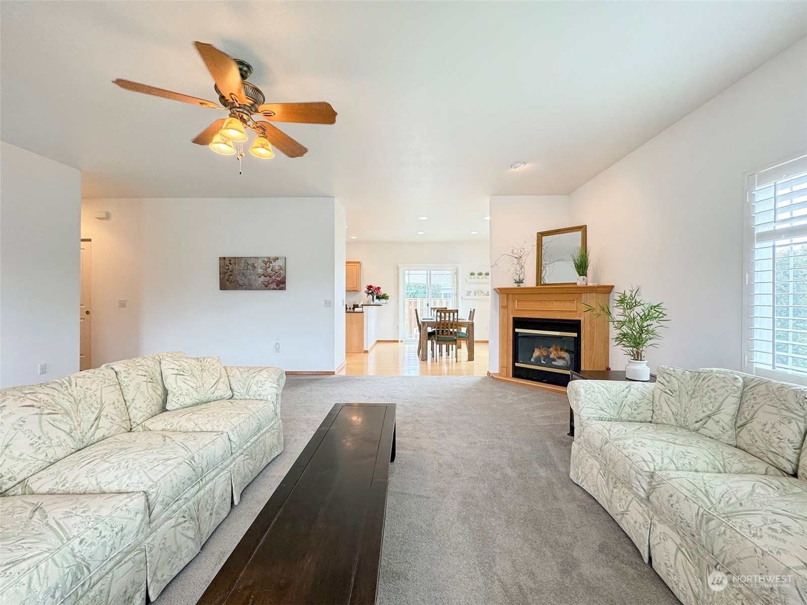 50 Nesting Place Sequim, WA 98382 - Photo 7 of 40 a living room with furniture a fireplace and a flat screen tv