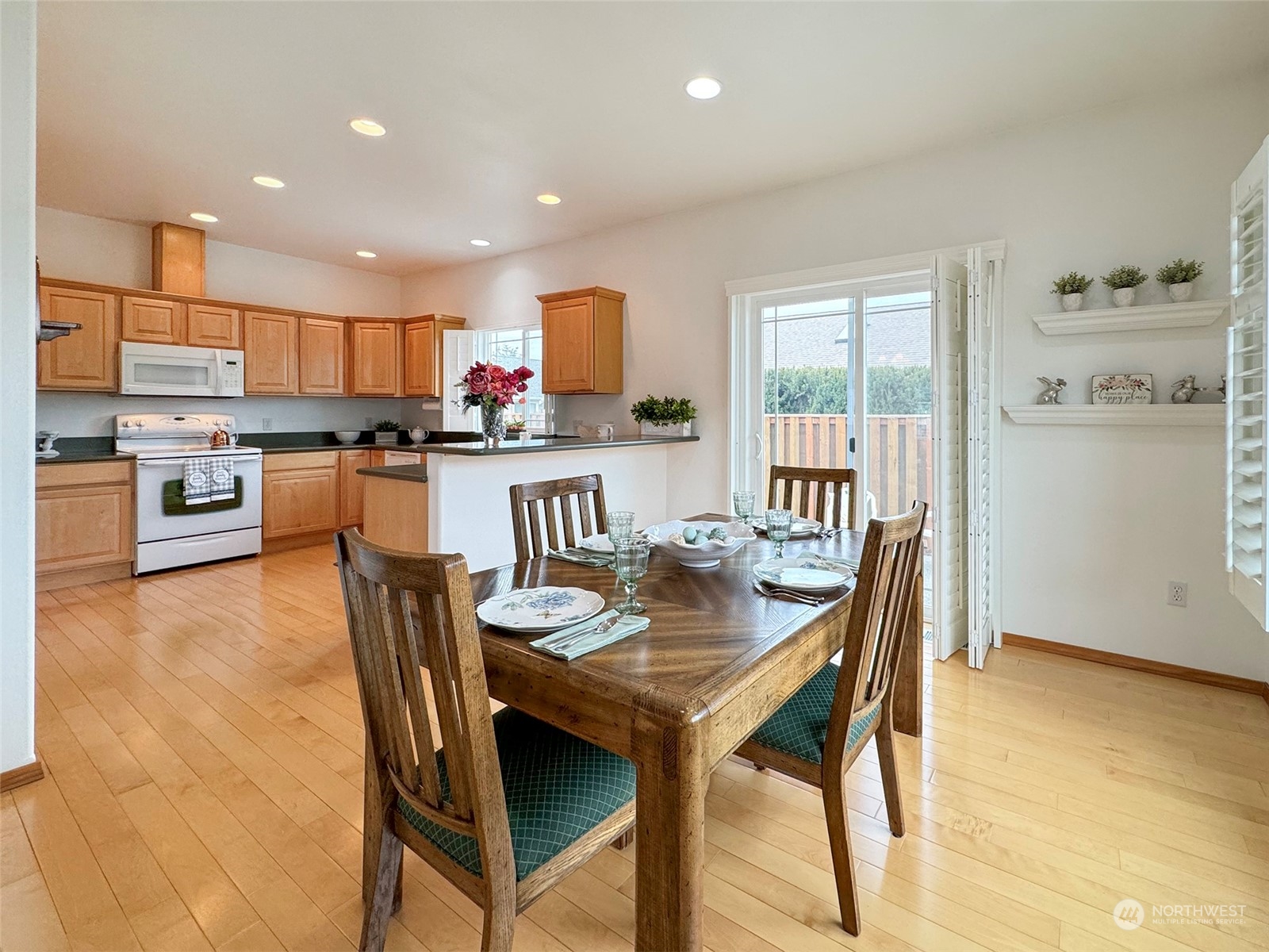 50 Nesting Place Sequim, WA 98382 - Photo 10 of 40 a view of a dining room with furniture window and wooden floor