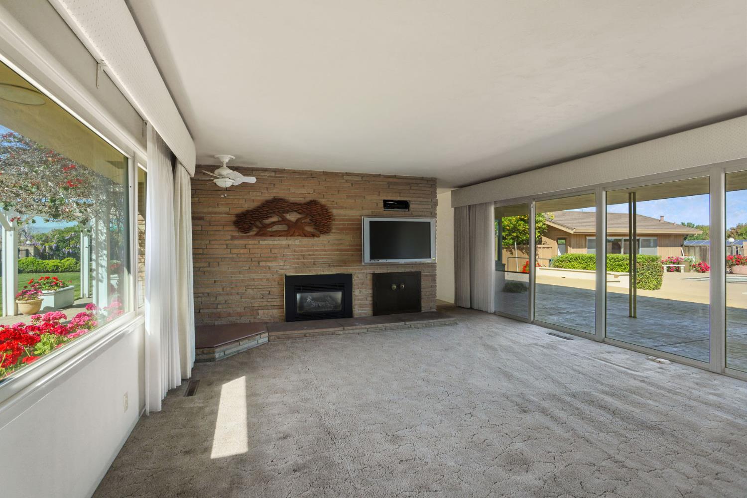2465 Vernalis Road Tracy, CA 95304 - Photo 14 of 55 wooden floor in an empty room with a fireplace