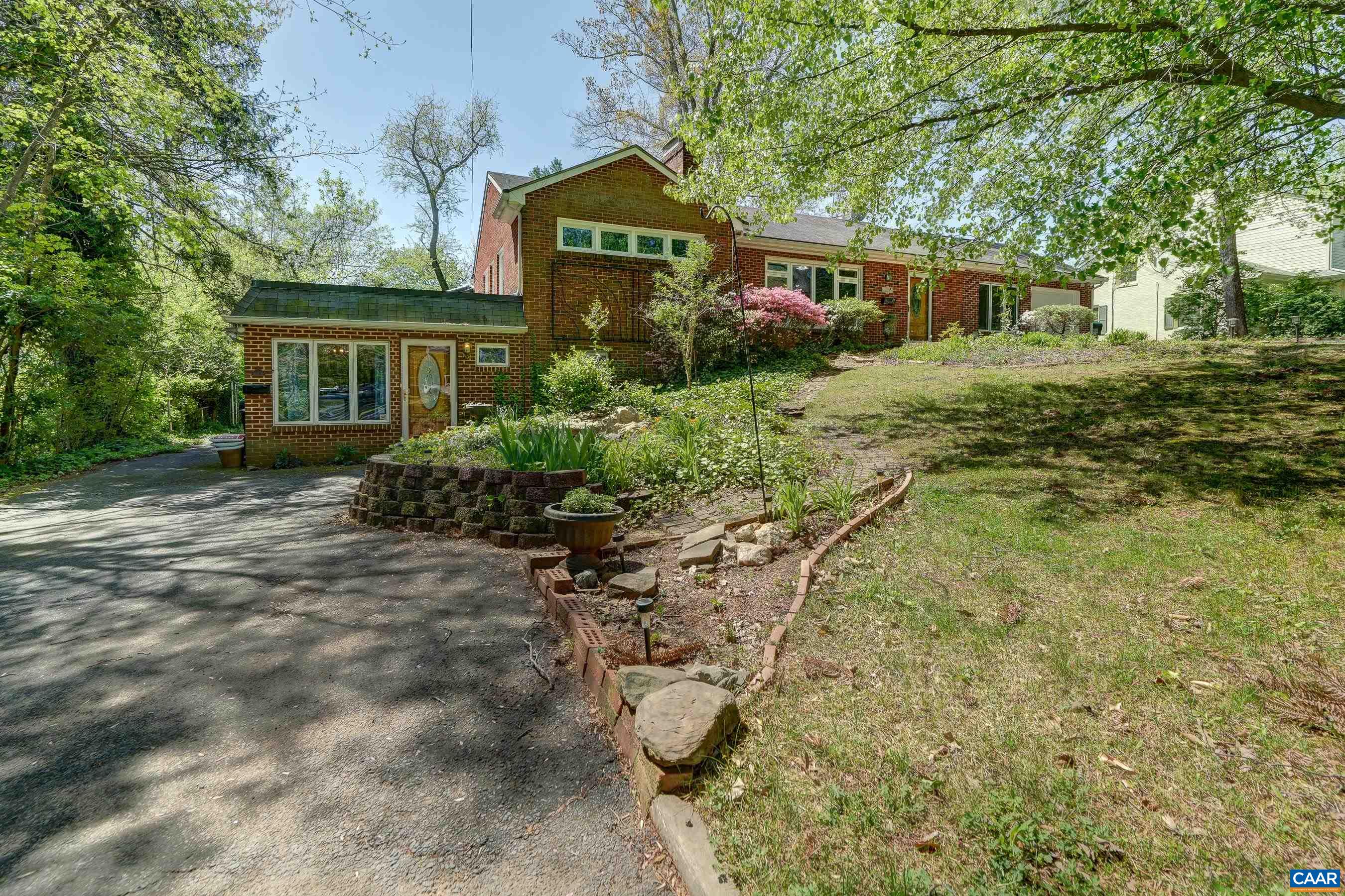 Brick ranch home with basement apartment on a large flat lot in Charlottesville.