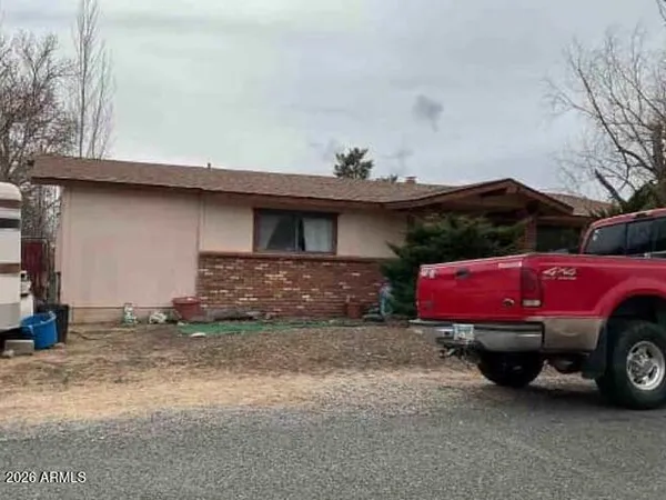 a view of a car in front of a house