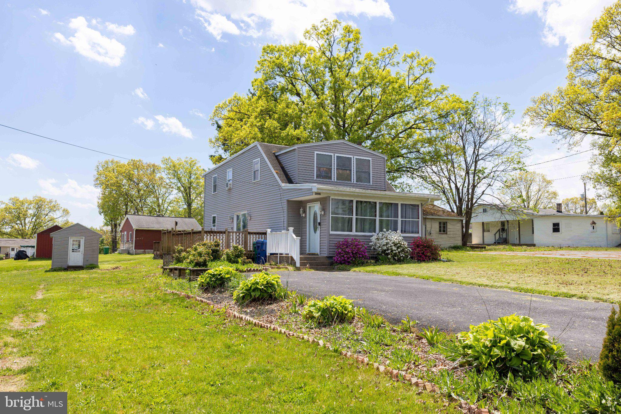 206 Beaver Road Harrisburg, PA 17112 - Photo 3 of 28 Charming home with lush greenery.