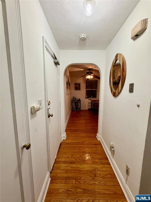 735 Elm Avenue, Unit 3E Teaneck, NJ 07666 - Photo 2 of 7 a hallway with wooden floor windows and entryway