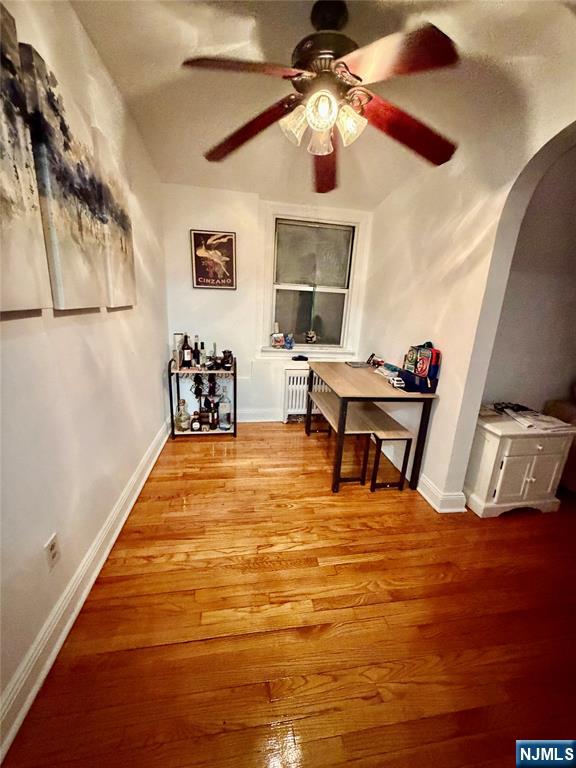 735 Elm Avenue, Unit 3E Teaneck, NJ 07666 - Photo 3 of 7 a room with table chairs and wooden floor