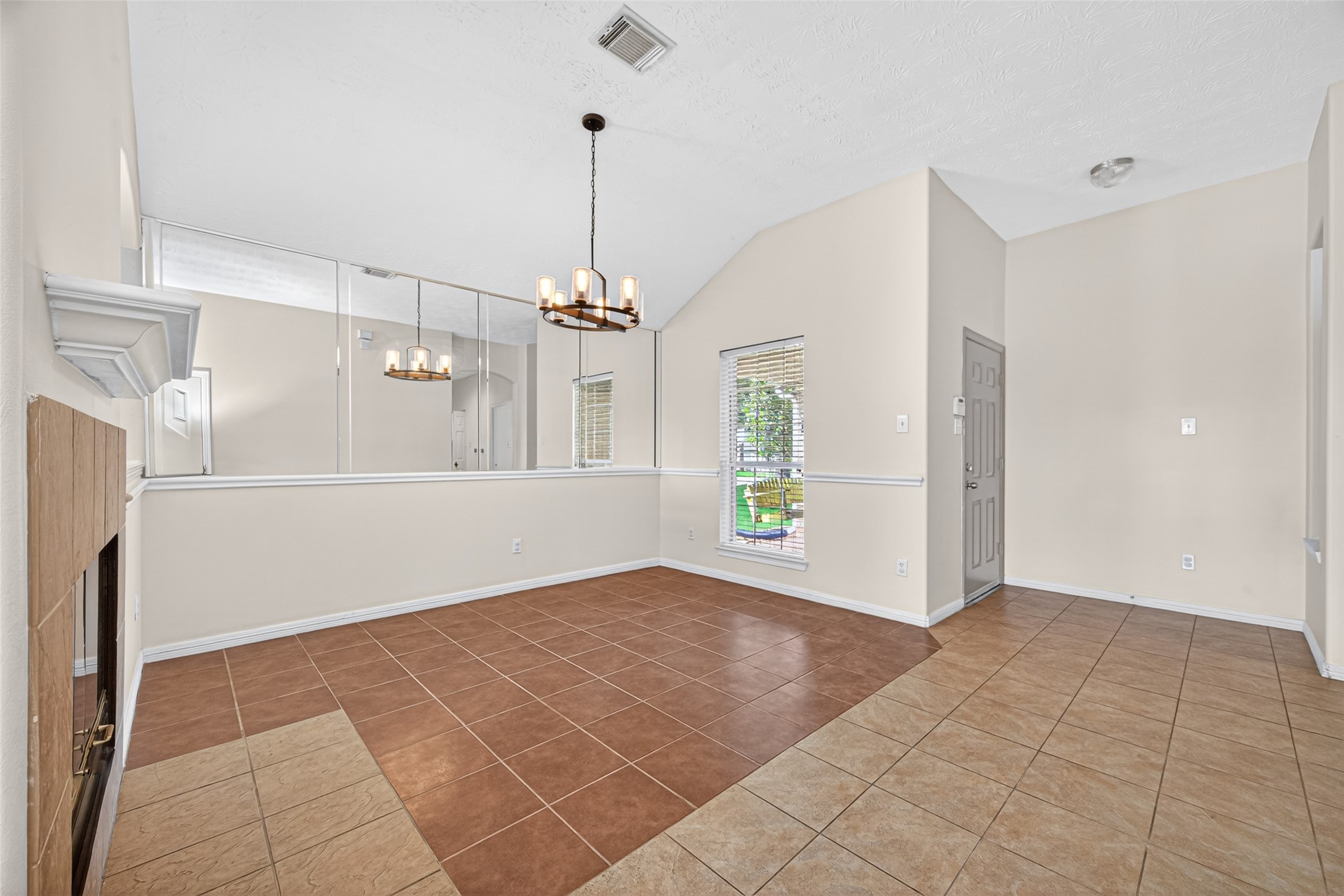 23914 Glengate Drive Spring, TX 77373 - Photo 7 of 49 a view of an empty room with window and chandelier fan