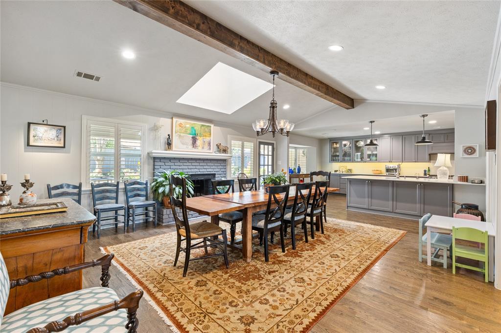 7138 Grand Oaks Road Dallas, TX 75230 - Photo 11 of 39 a view of a dining room with furniture