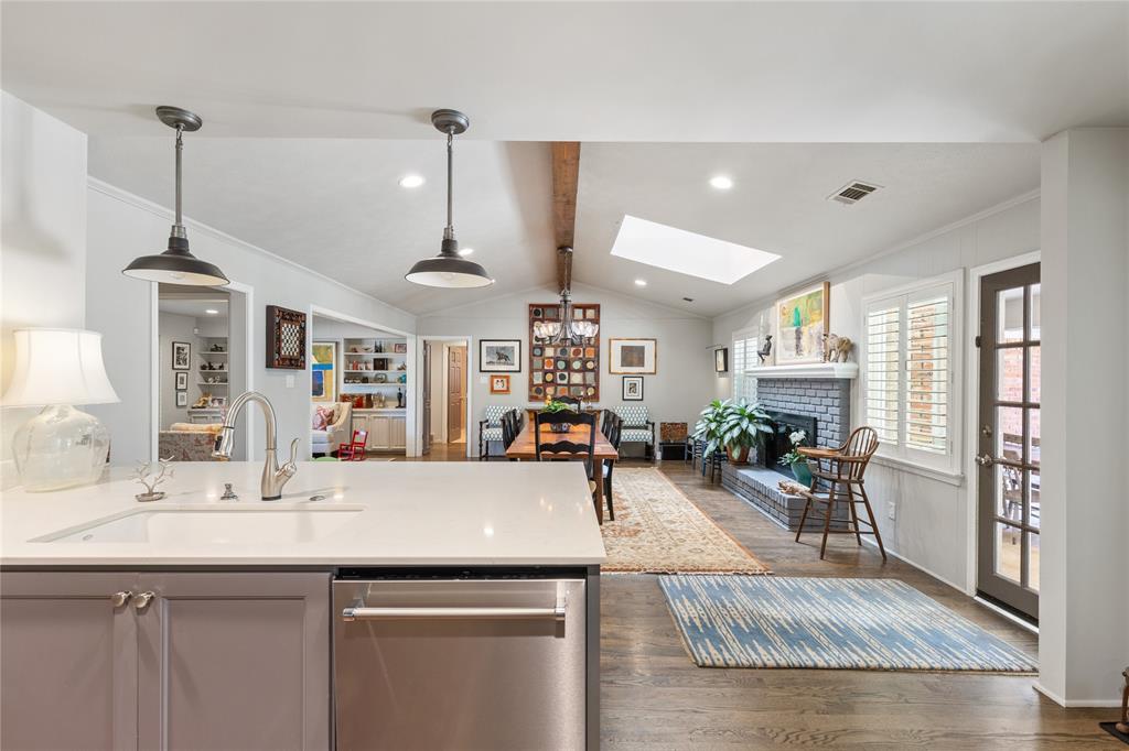 7138 Grand Oaks Road Dallas, TX 75230 - Photo 17 of 39 a view of a living room and kitchen view