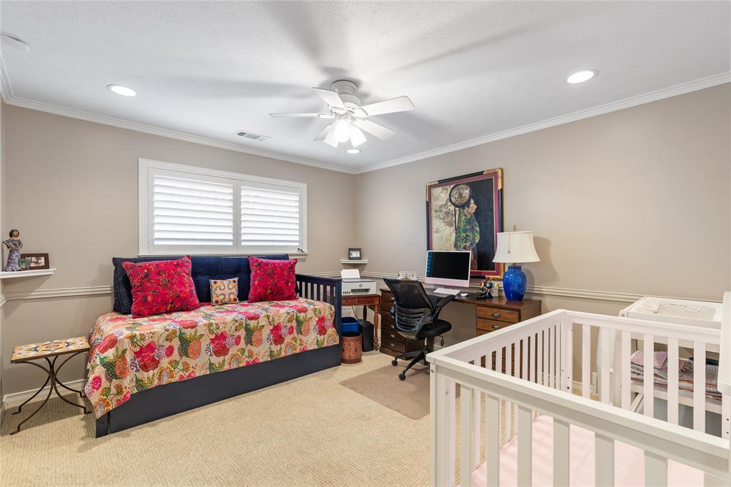 7138 Grand Oaks Road Dallas, TX 75230 - Photo 26 of 39 a bedroom with furniture and a large window