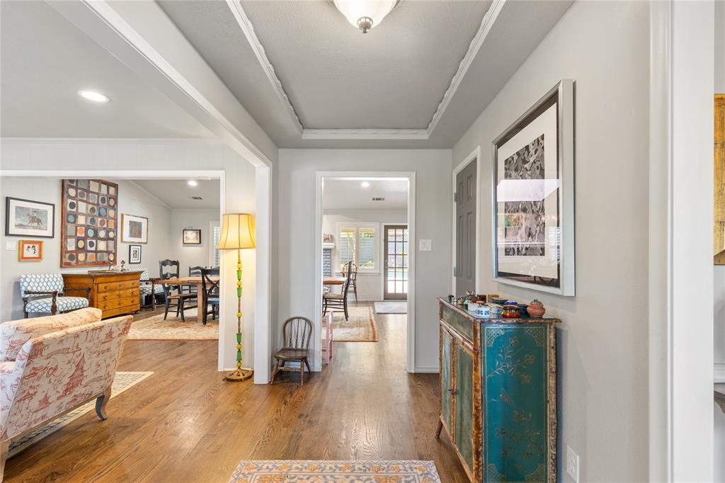 7138 Grand Oaks Road Dallas, TX 75230 - Photo 3 of 39 a view of a living room and dining room