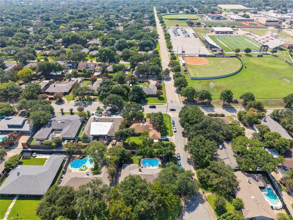 7138 Grand Oaks Road Dallas, TX 75230 - Photo 32 of 39 an aerial view of a house with a yard and lake view