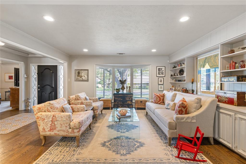 7138 Grand Oaks Road Dallas, TX 75230 - Photo 4 of 39 a living room with furniture and a large window
