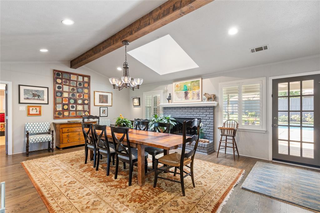 7138 Grand Oaks Road Dallas, TX 75230 - Photo 9 of 39 a view of a dining room with furniture window and wooden floor