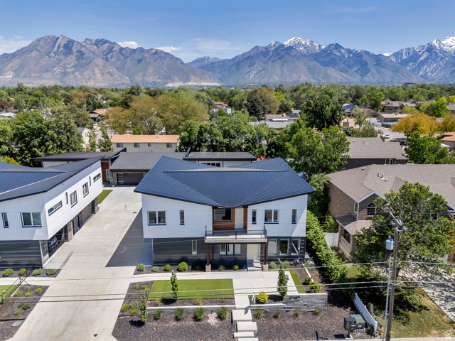 7045 South 300 East Midvale, UT 84047 - Photo 6 of 49 Modern architectural design featuring a crisp white facade and dark metal roofing