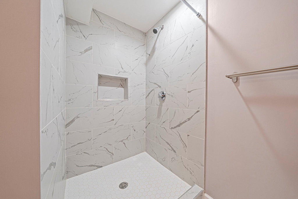 9 Powder Hill Way, Unit 9 Westborough, MA 01581 - Photo 23 of 40 a bathroom with a shower and a shower