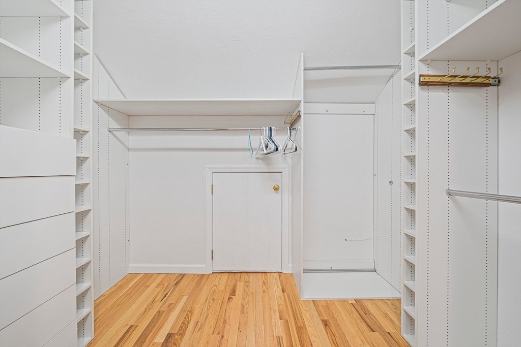 9 Powder Hill Way, Unit 9 Westborough, MA 01581 - Photo 25 of 40 a view of walk in closet with empty racks