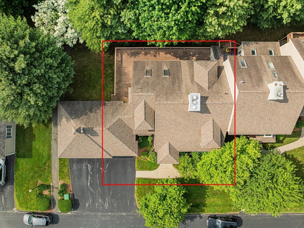 9 Powder Hill Way, Unit 9 Westborough, MA 01581 - Photo 35 of 40 an aerial view of a house with a yard and garden