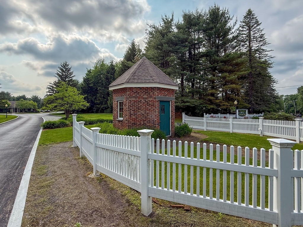 9 Powder Hill Way, Unit 9 Westborough, MA 01581 - Photo 36 of 40 a view of a house with wooden fence