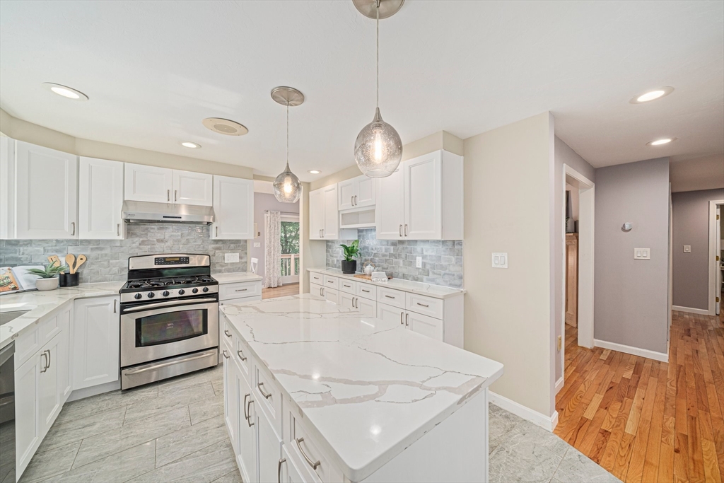 9 Powder Hill Way, Unit 9 Westborough, MA 01581 - Photo 4 of 40 a kitchen with white cabinets and stainless steel appliances