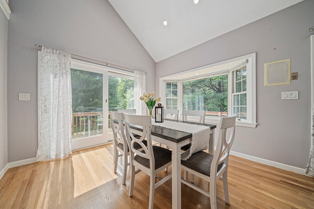 9 Powder Hill Way, Unit 9 Westborough, MA 01581 - Photo 6 of 40 a view of a dining room with furniture window and wooden floor