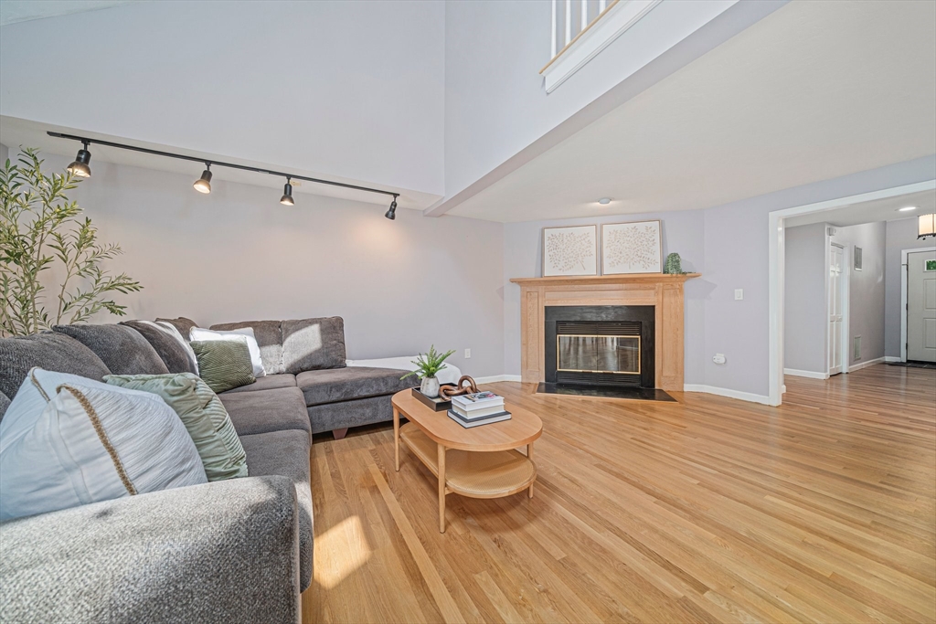 9 Powder Hill Way, Unit 9 Westborough, MA 01581 - Photo 8 of 40 a living room with furniture and a fireplace