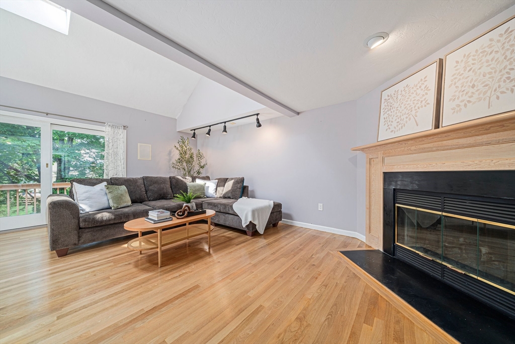 9 Powder Hill Way, Unit 9 Westborough, MA 01581 - Photo 9 of 40 a bedroom with furniture and a fireplace