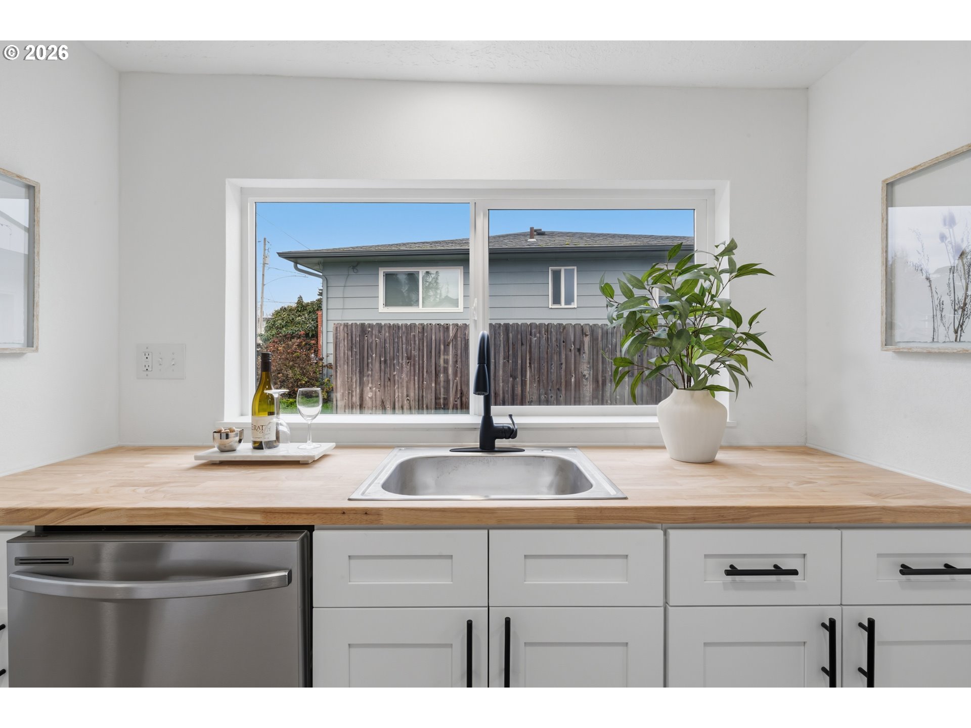 1730 Southwest 12th Avenue Albany, OR 97321 - Photo 2 of 24 a kitchen with a sink and a mirror