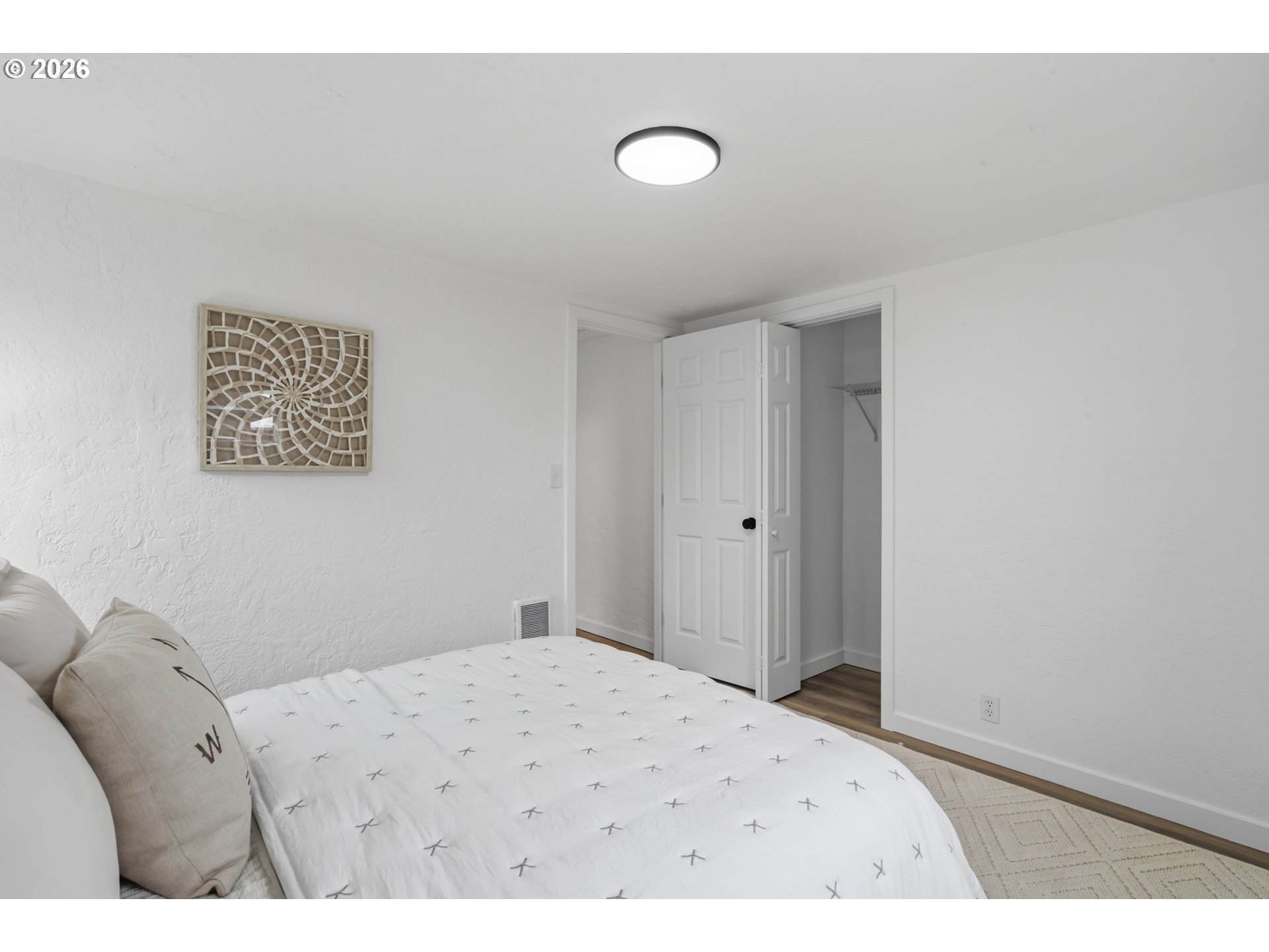 1730 Southwest 12th Avenue Albany, OR 97321 - Photo 10 of 24 a bedroom with a bed and a painting on the wall