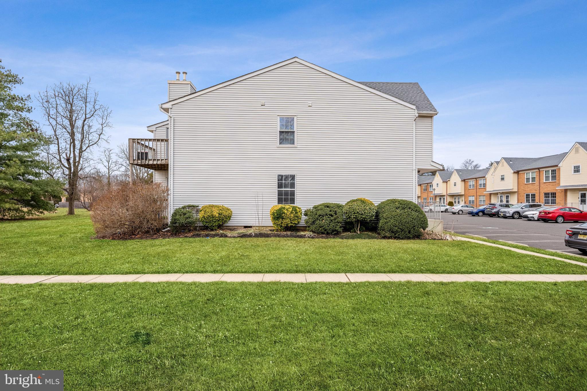 201 Sandstone Court Lumberton, NJ 08048 - Photo 18 of 19 a front view of a house with a yard and garage