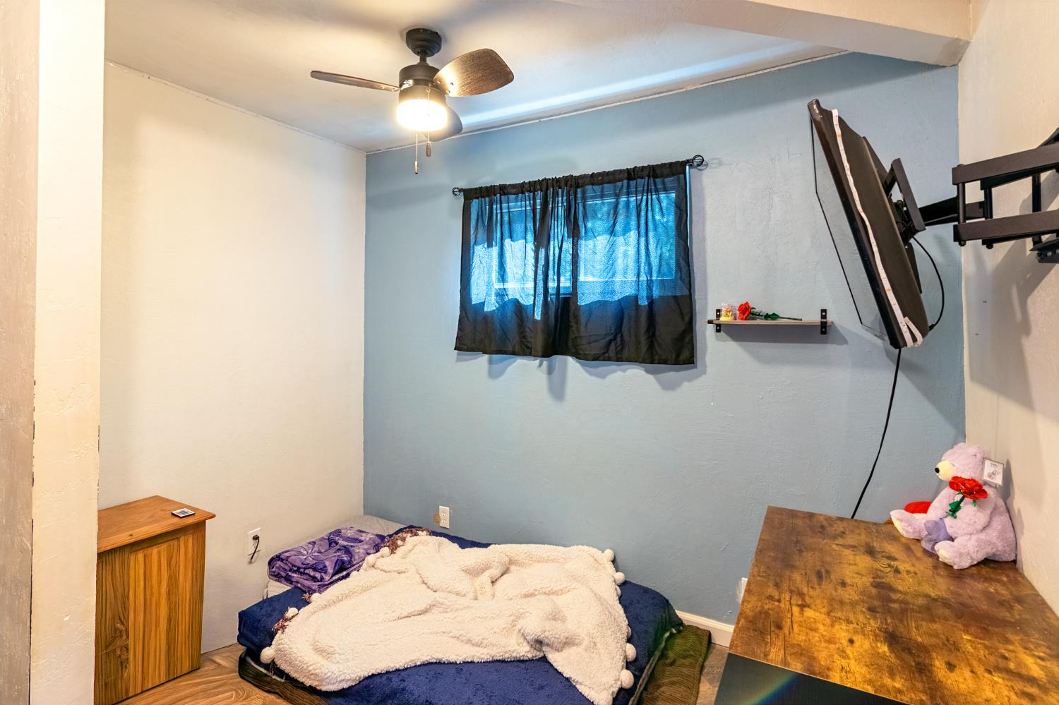 22700 Johnson Valley Road Foresthill, CA 95631 - Photo 23 of 68 a bedroom with a bed and wooden floor