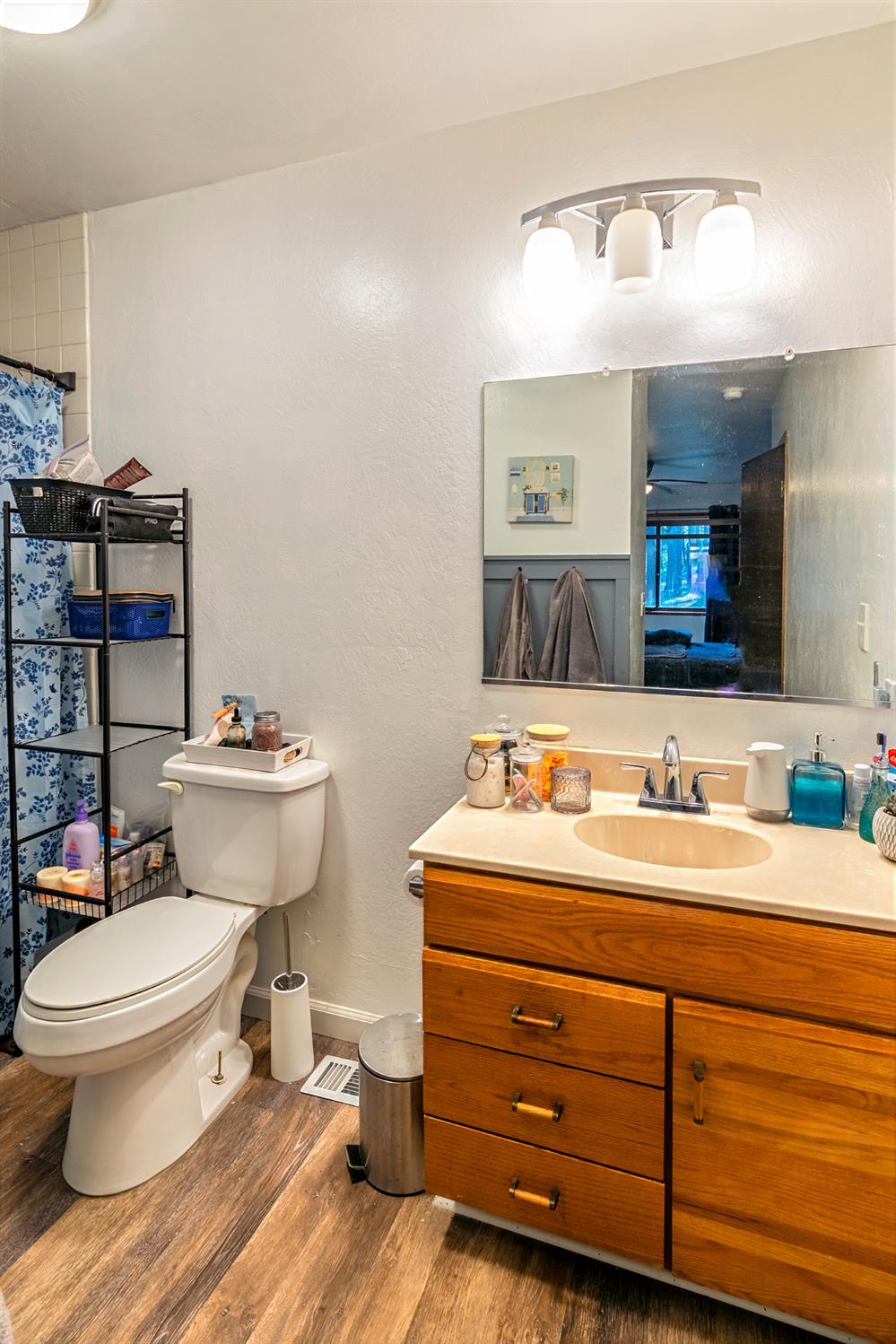 22700 Johnson Valley Road Foresthill, CA 95631 - Photo 25 of 68 a bathroom with a toilet sink and mirror