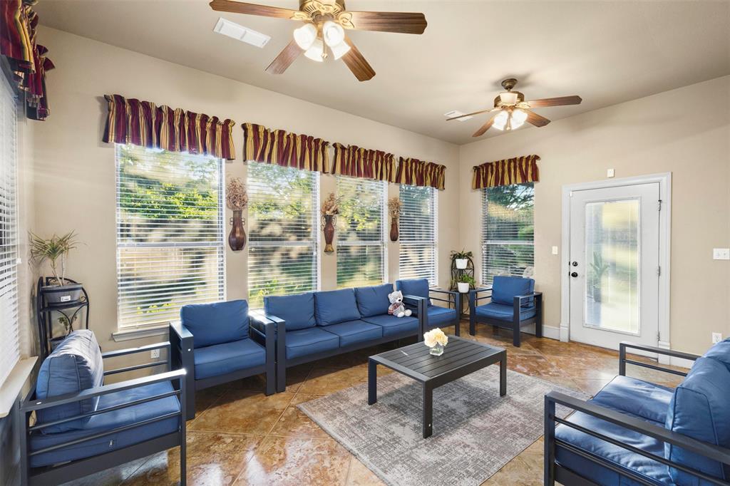 105 Country Ridge Court Red Oak, TX 75154 - Photo 19 of 40 a living room with furniture and a large window