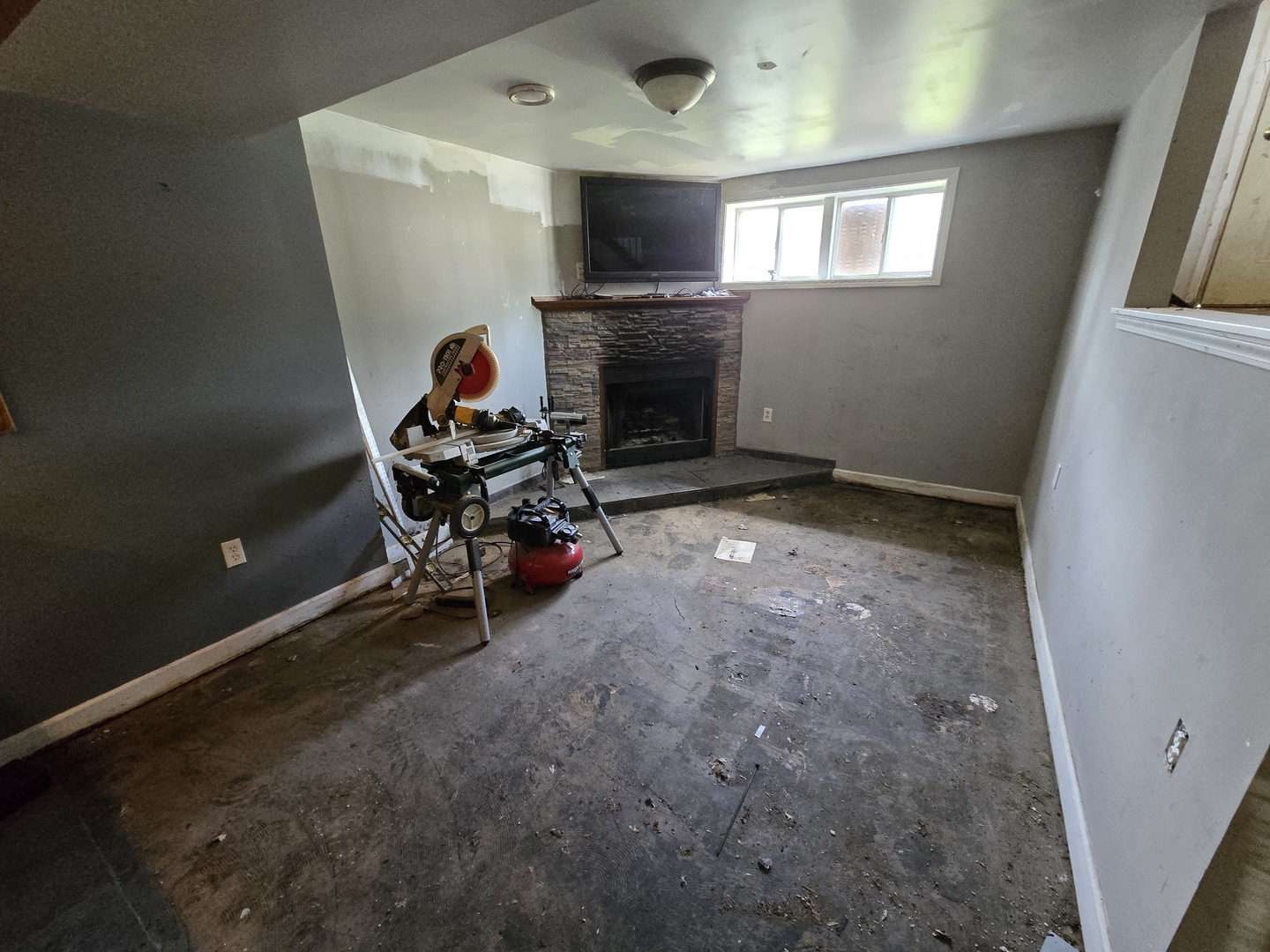 225 Haller Avenue Romeoville, IL 60446 - Photo 3 of 6 a living room with furniture a flat screen tv and a fireplace