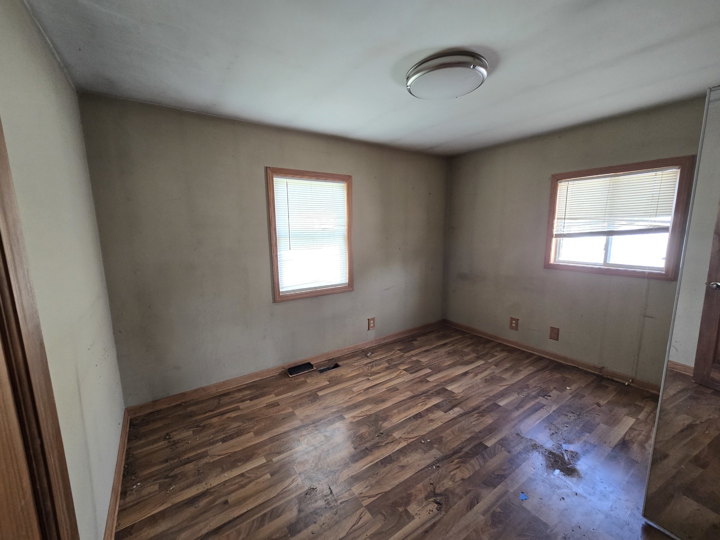 225 Haller Avenue Romeoville, IL 60446 - Photo 6 of 6 a view of an empty room with wooden floor and a window