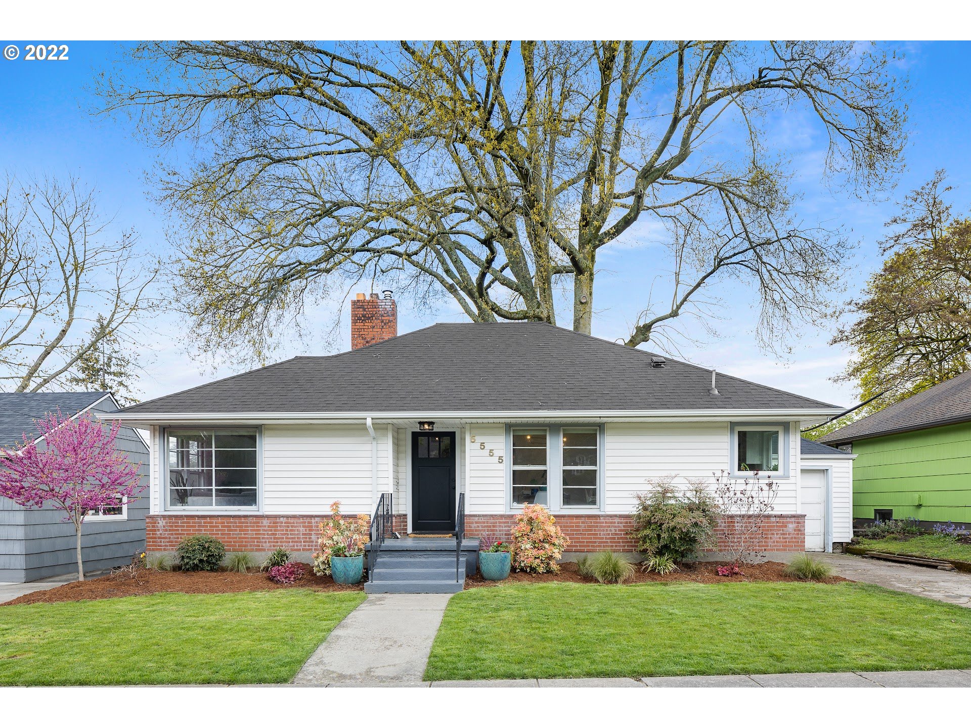 front view of a house and a yard