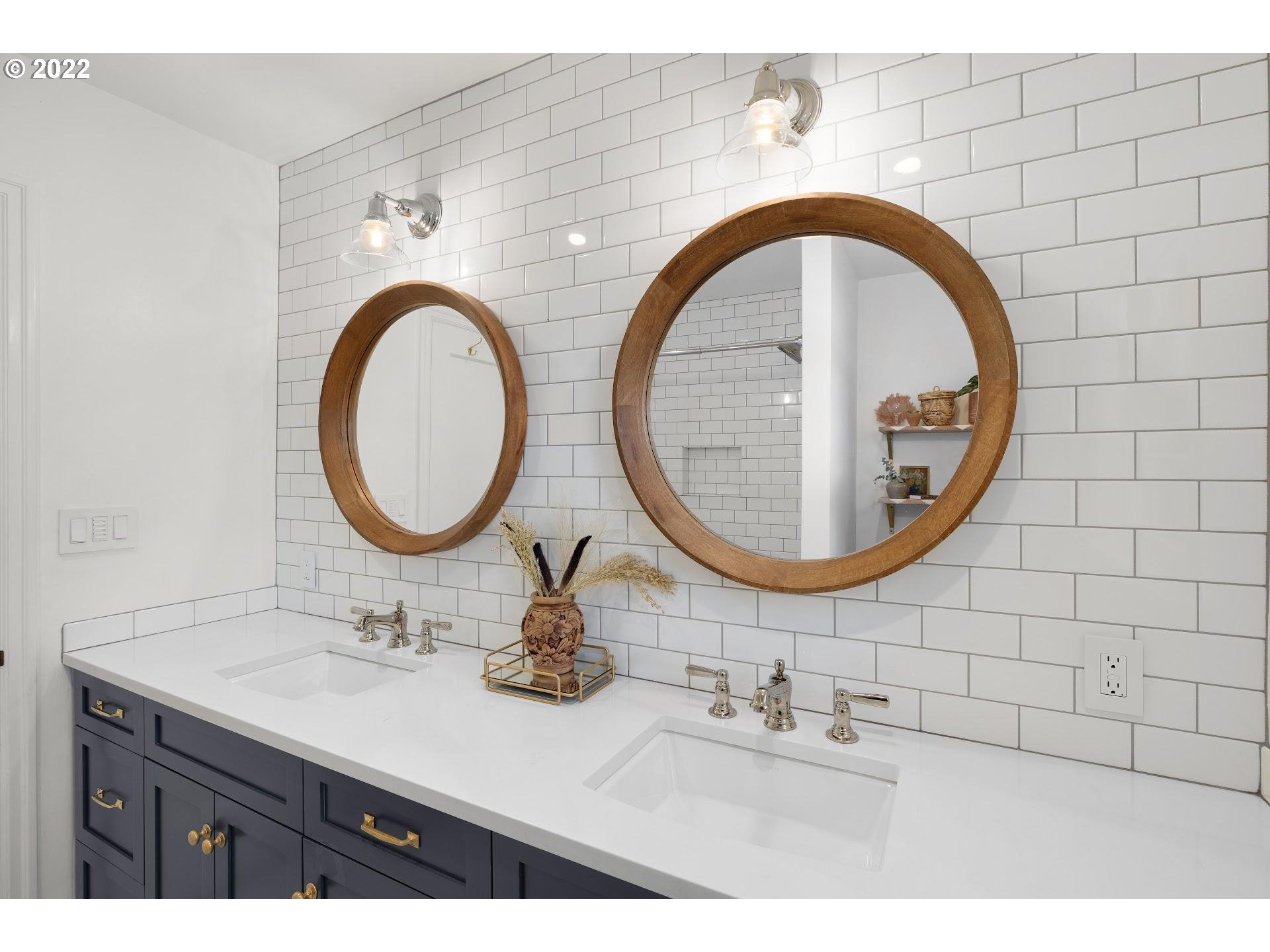 5555 Southeast Stark Street Portland, OR 97215 - Photo 15 of 21 a bathroom with a sink and a mirror