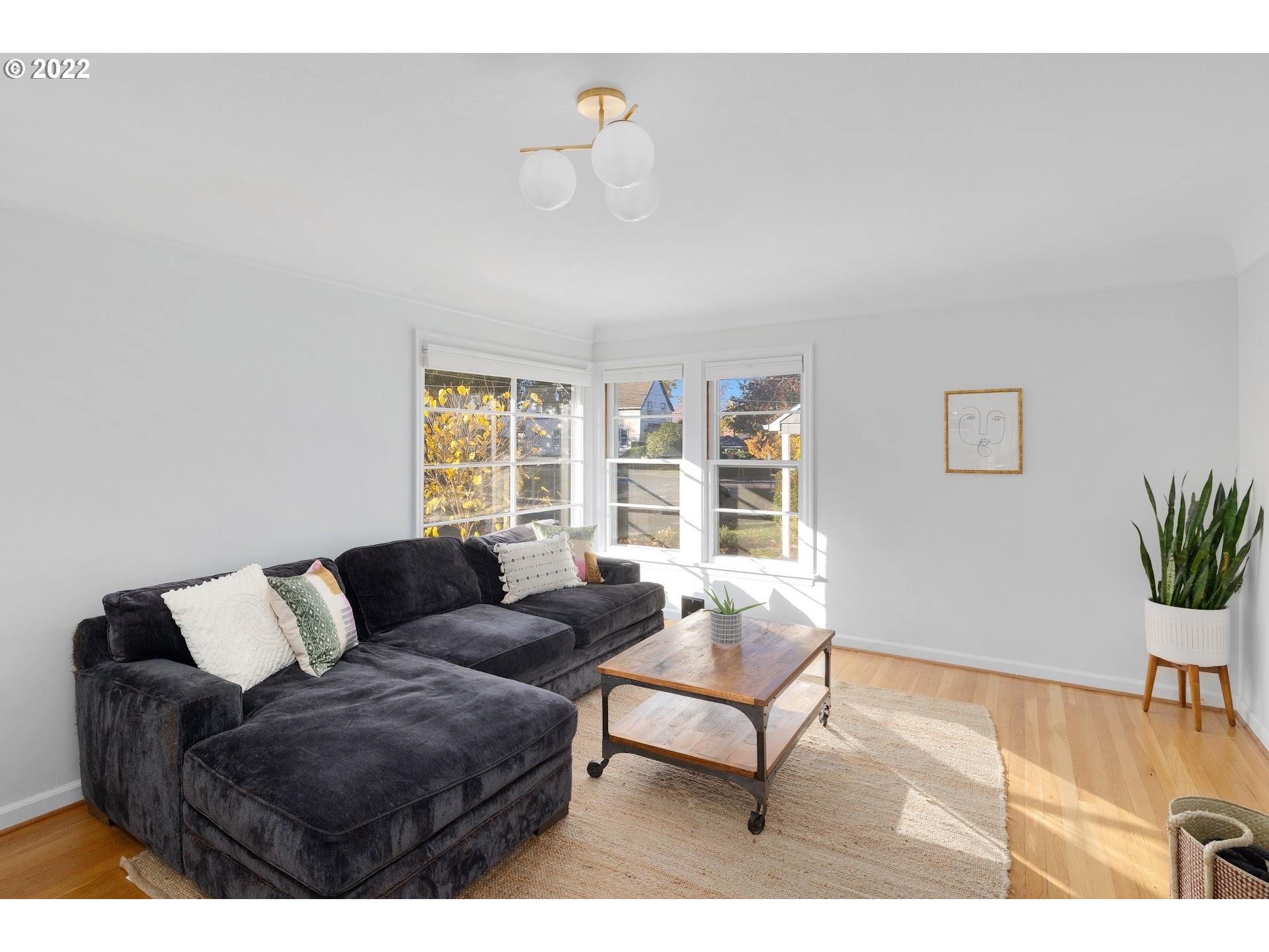 5555 Southeast Stark Street Portland, OR 97215 - Photo 6 of 21 a living room with furniture and a window
