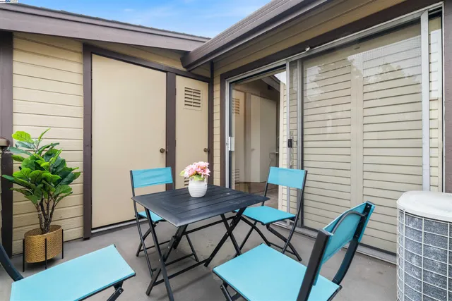 a outdoor dining space with furniture