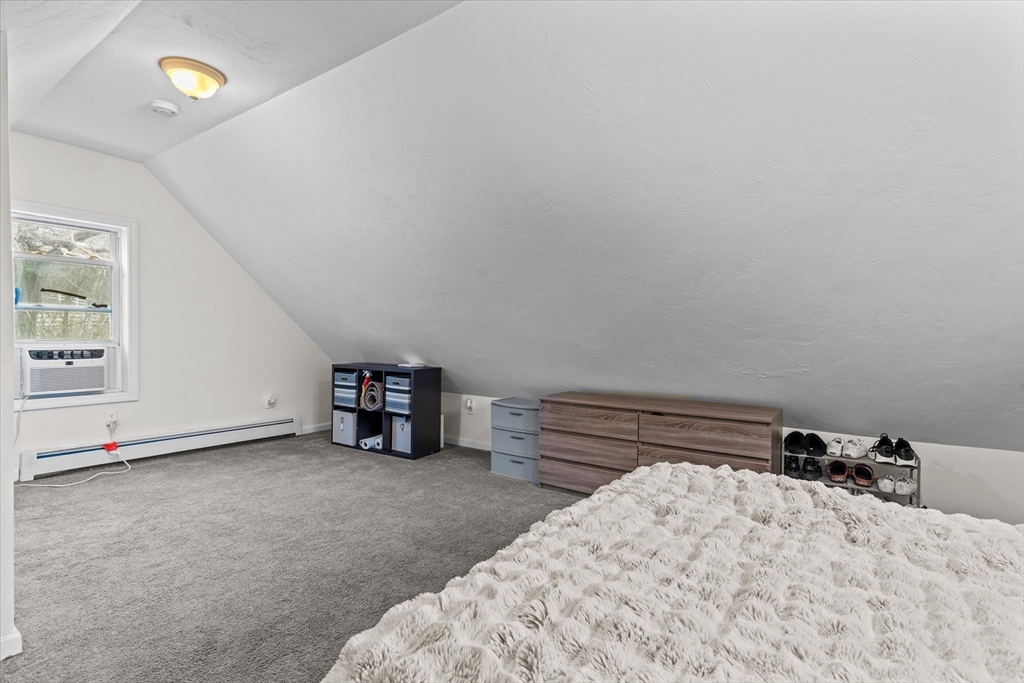 3 Douglas Road Webster, MA 01570 - Photo 15 of 24 a bed room with a bed and a tv on the dresser