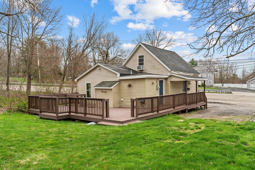 3 Douglas Road Webster, MA 01570 - Photo 19 of 24 a view of a house with a yard and sitting area