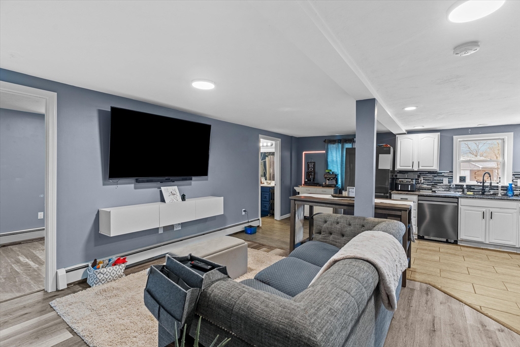 3 Douglas Road Webster, MA 01570 - Photo 7 of 24 a living room with furniture and a flat screen tv